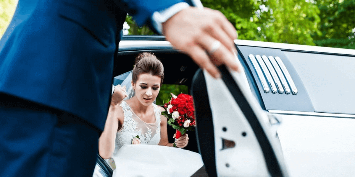 Bride getting out of limousine.