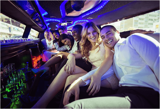 Friends celebrating in a limousine.