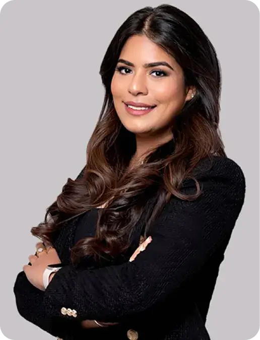 Confident businesswoman, arms crossed.