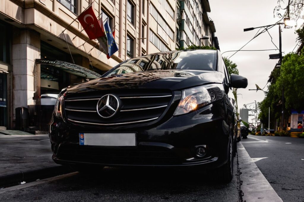 Luxury black Mercedes-Benz Vito parked on a Turkish city street, capturing urban elegance.